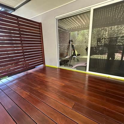 Dark stained deck with timber slat screen
