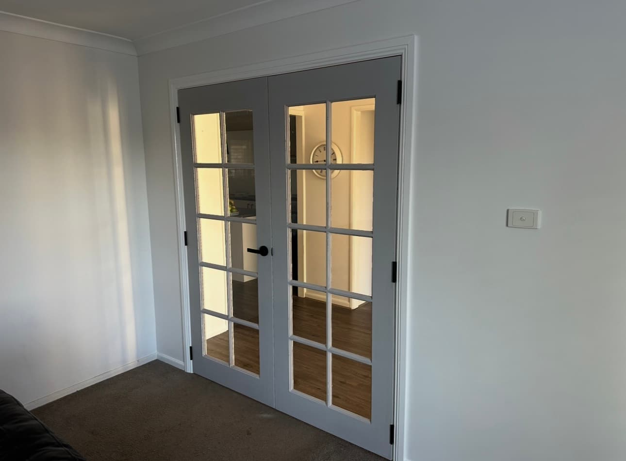 French doors to living room — 10-lite glazed pair, matte black hardware